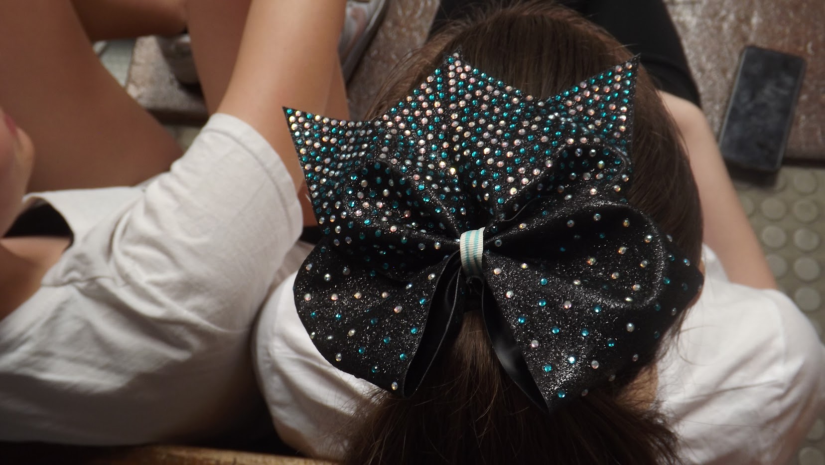 Fiocco teal, dettaglio dell'uniforme Intensity Elite